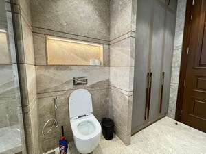 Bathroom in 4 BHK Apartment at Vasant Vihar – for Rent