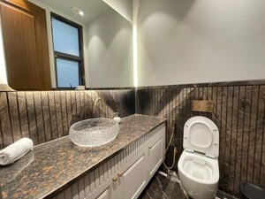 Bathroom in 4 BHK Apartment at Vasant Vihar – for Rent