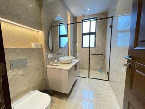 Bathroom in 4 BHK Apartment at Vasant Vihar – for Rent