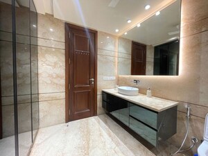 Bathroom in 3 BHK Apartment at Defence Colony – for Rent