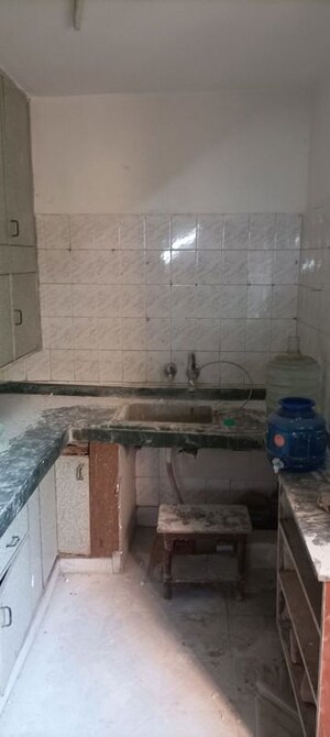 Kitchen in 2 BHK Apartment at RWA Jalvayu Vihar, Sector 25 – for Rent