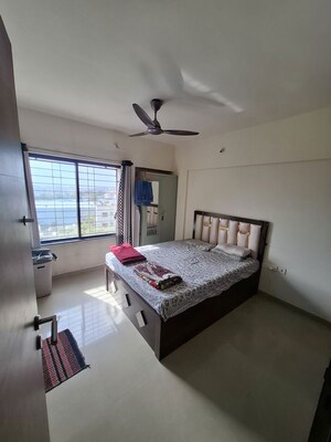 Bedroom in 2 BHK Apartment at Rainbow Revell Orchid, Lohgaon – for Rent