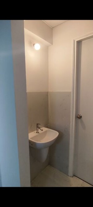 Bathroom in 1 BHK Apartment at Runwal Gardens, Dombivli East – for Rent