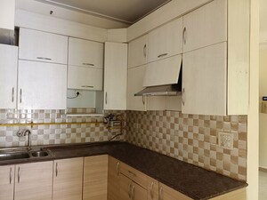 Kitchen in 2 BHK Apartment at Gaur City 2 - 12th Avenue, Sector 16c Greater Noida – for Rent