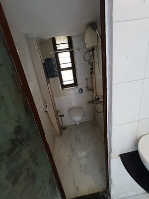Bathroom in 1 BHK Apartment at Express Apartment, Yari Road – for Rent
