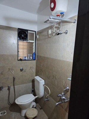 Bathroom in 2 BHK Apartment at GK Dwarka Sai, Rahatani – for Rent
