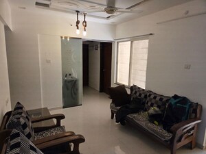 Living Room in 2 BHK Apartment at GK Dwarka Sai, Rahatani – for Rent