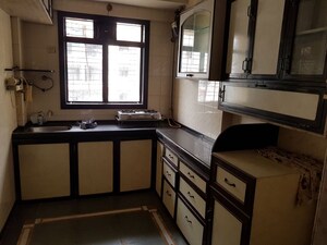 Kitchen in 2 BHK Apartment at Natraj Building, Mulund West – for Rent