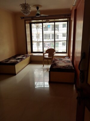 Living Room in 2 BHK Apartment at Natraj Building, Mulund West – for Rent