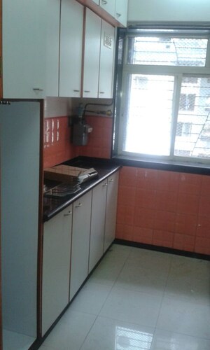 Kitchen in 3 BHK Apartment at Nirmal Lifestyle Residency CHS Ltd, Mulund West – for Rent