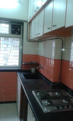 Kitchen in 3 BHK Apartment at Nirmal Lifestyle Residency CHS Ltd, Mulund West – for Rent