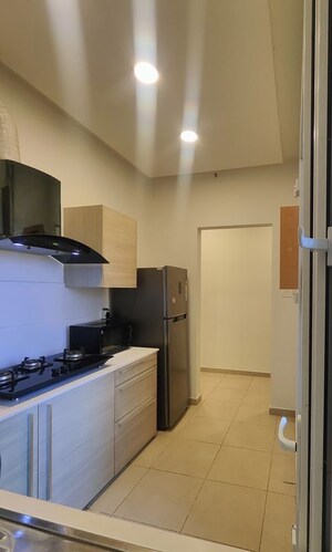 Kitchen in 2 BHK Apartment at Bhartiya City Nikoo Homes II, Thanisandra Main Road – for Rent