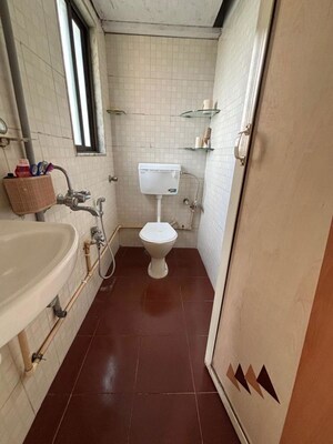 Bathroom in 1 BHK Apartment at AMI Jharna, Goregaon East – for Rent