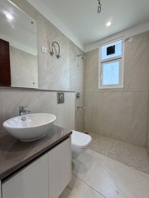 Bathroom in 4 BHK Apartment at Dhakoli – for Sale