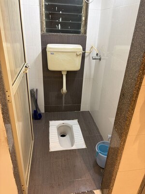 Bathroom in 3 BHK Apartment at Samarpan CHS, Mira Road – for Rent
