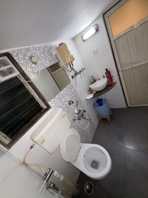 Bathroom in 3 BHK Apartment at Samarpan CHS, Mira Road – for Rent