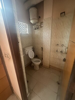 Bathroom in 1.5 BHK Apartment at Jangpura – for Rent