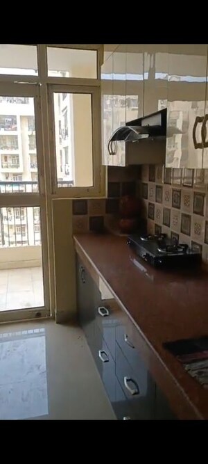 Kitchen in 3 BHK Apartment at Uninav Heights Phase I, Raj Nagar Extension – for Rent