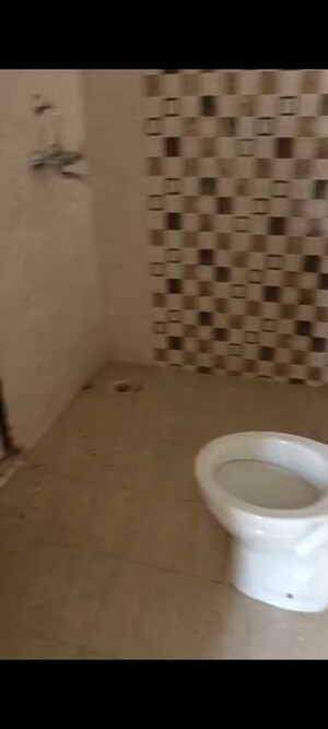 Bathroom in 3 BHK Apartment at Uninav Heights Phase I, Raj Nagar Extension – for Rent
