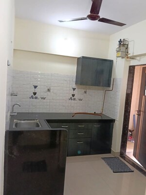 Kitchen in 1 BHK Apartment at Kishor Sukur Enclave A, Ghodbunder Road – for Sale