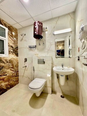 Washroom in 3 BHK Apartment at Omaxe The Palace, Gomti Nagar – for Rent