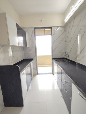 Kitchen in 2 BHK Apartment at Mohan Precious Greens, Ambernath – for Rent