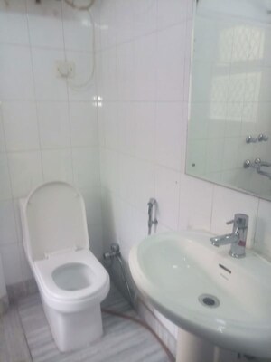 Bathroom in 3 BHK Apartment at Safdarjung Development Area – for Rent