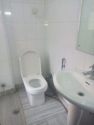 Bathroom in 3 BHK Apartment at Safdarjung Development Area – for Rent