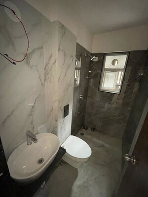 Bathroom in 4 BHK Apartment at Our Home CHS, Andheri West – for Sale
