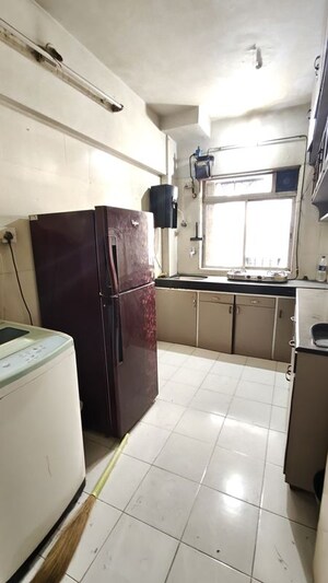 Kitchen in 2 BHK Apartment at Dheeraj Uphar CHS. LTD., Malad East – for Rent