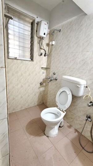 Bathroom in 2 BHK Apartment at Dheeraj Uphar CHS. LTD., Malad East – for Rent