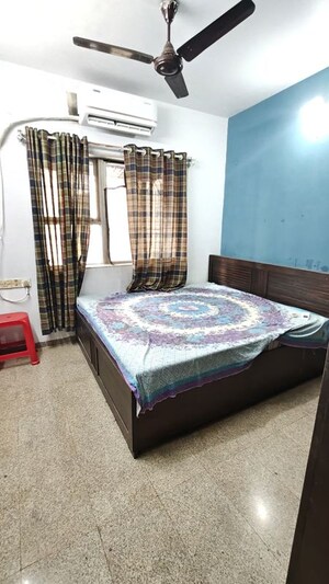 Bedroom in 2 BHK Apartment at Dheeraj Uphar CHS. LTD., Malad East – for Rent