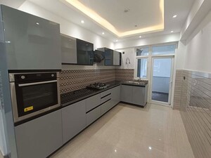 Kitchen in 5 BHK Apartment at Mahagun Marvella, Sector 78 – for Sale