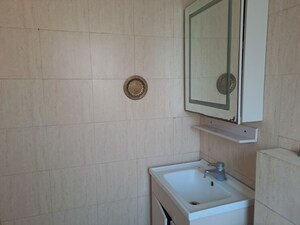 Bathroom in 3.5 BHK Builder Floor at Orchid Island, Sector 51 – for Sale