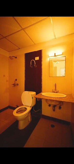 Bathroom in 2 BHK Apartment at Meenal Balmukund Residency, Raj Nagar Extension – for Sale
