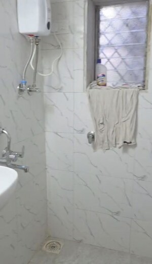 Bathroom in 1 BHK Apartment at Shaheed Bhagat Singh CHS, Andheri East – for Rent