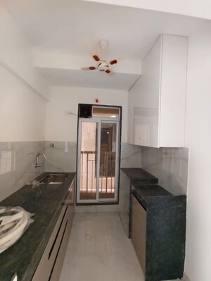 Kitchen in 1 BHK Apartment at Metropolis Bayside, Kasarvadavali – for Rent