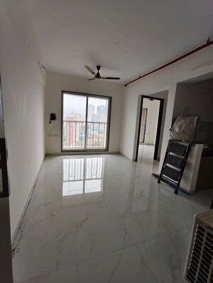 Living Room in 1 BHK Apartment at Metropolis Bayside, Kasarvadavali – for Rent
