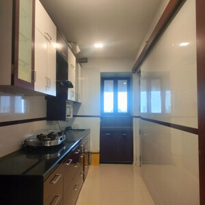 Kitchen in 3 BHK Apartment at Oberoi Sky Gardens, Andheri West – for Rent