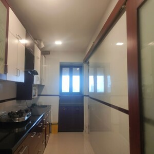 Kitchen in 3 BHK Apartment at Oberoi Sky Gardens, Andheri West – for Rent