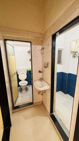 Bathroom in 1 BHK Apartment at Swapna Sangeet CHS, Mulund West – for Rent