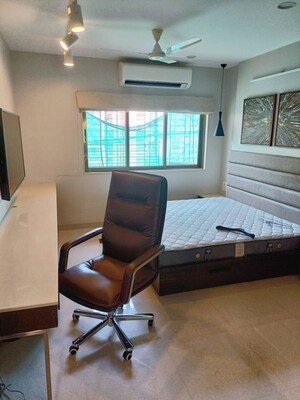 Living Room in 4 BHK Apartment at Indradarshan II, Oshiwara – for Sale