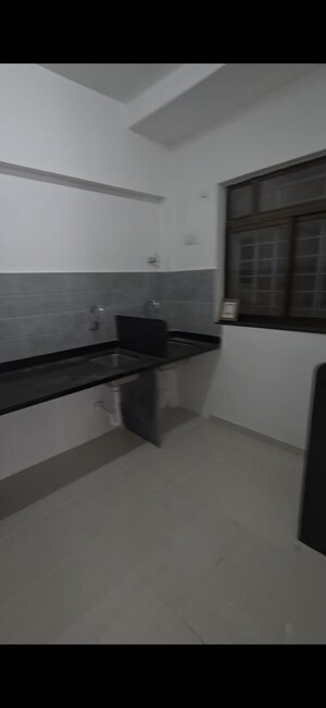 Kitchen in 2 BHK Apartment at Roshan Milestone, Tathawade – for Sale