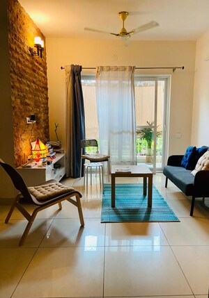 Living Room in 1 BHK Apartment at Brigade Bricklane, Jakkuru – for Rent