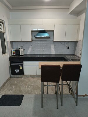 Kitchen in Studio Apartment at Nimbus The Golden Palm, Sector 168 – for Rent