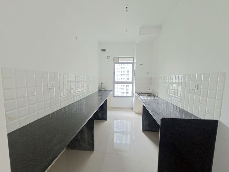 Kitchen, kalpataru-immensa-c 2 Bedroom 761 Sq.Ft. Apartment In Kolshet Road Thane 10694514