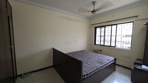 Bedroom in 2 BHK Apartment at Alguj CHS, Vasant Vihar – for Rent