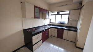 Kitchen in 2 BHK Apartment at Alguj CHS, Vasant Vihar – for Rent