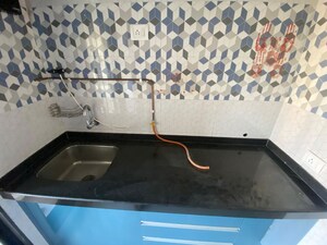 Kitchen in 1 BHK Apartment at Raunak Unnathi Woods Phase 7 A And B, Ghodbunder Road – for Rent