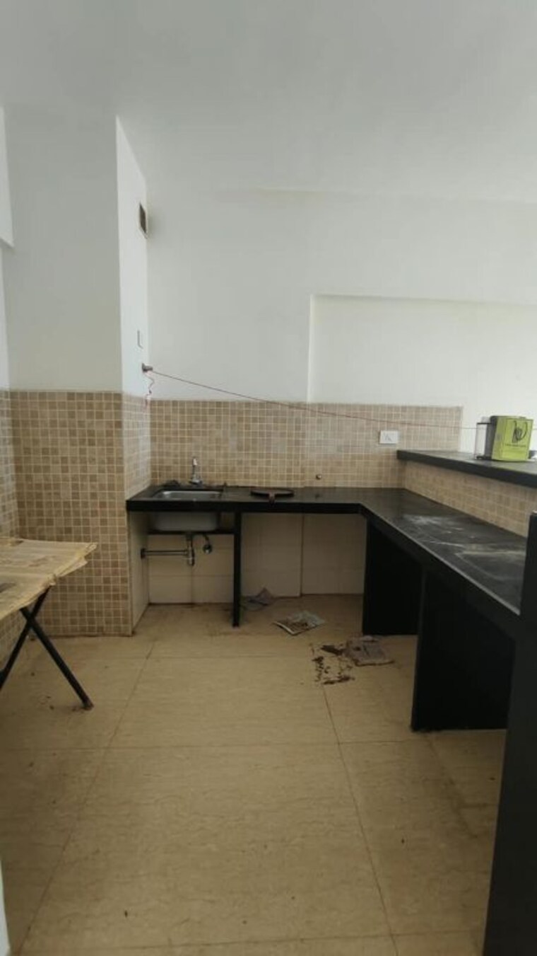 Kitchen, lodha-belmondo 1 Bedroom 705 Sq.Ft. Apartment In Gahunje Pune 10694967